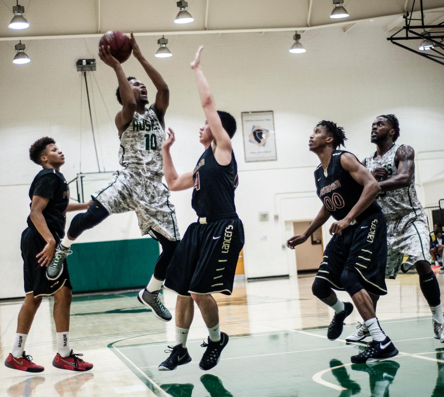 AIR BOUND&mdash;East Los Angeles College sophomore guard Miles Ford, No. 10, leaps to attempt a jump shot in the Huskies' 75-71 win against Pasadena City College in the South Gym on Feb. 12. (Photo by Tadzio Garcia)