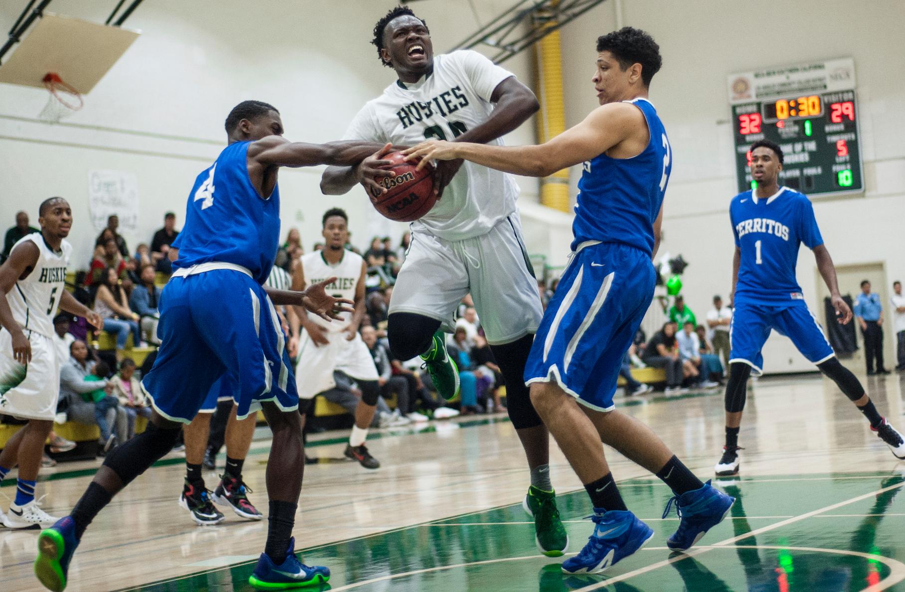 East Los Angeles freshman guard Sequan Walker attempts  a layup in the paint in a 68-63 overtime win against Cerritos College in a CCCAA Southern Regional playoff game on Feb. 24 in the South Gym.  (Photo by Tadzio Garcia)