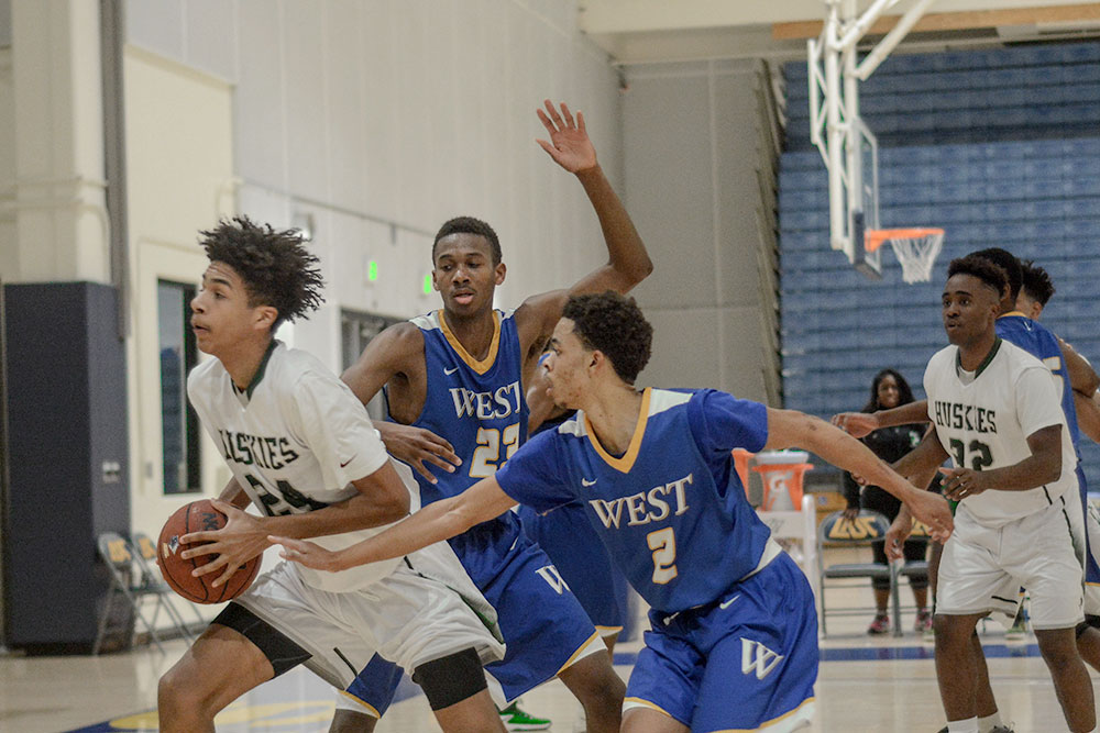 East Los Angeles College freshman guard Jermaine Small-Camacho drives towards the lane as freshman guard Brian Simmons looks on in an 89-75 win vs. West LA College.