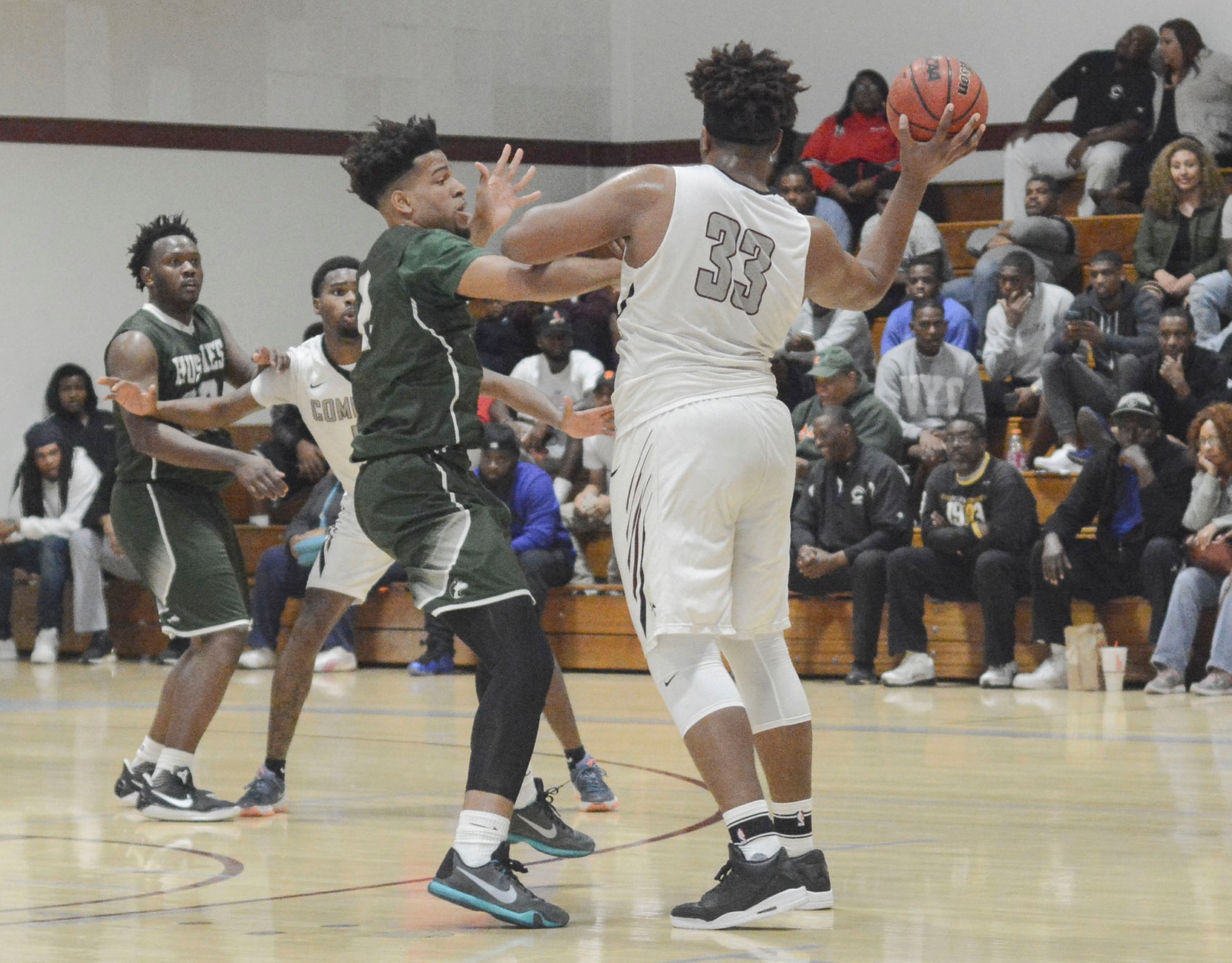 East Los Angeles College sophomore guard Zeno Lake works on defense while ECC Compton Center sophomore forward DaJion Henderson attempts to pass in an 83-80 Husky win in the Sweet 16. (Photo by Tadzio Garcia)