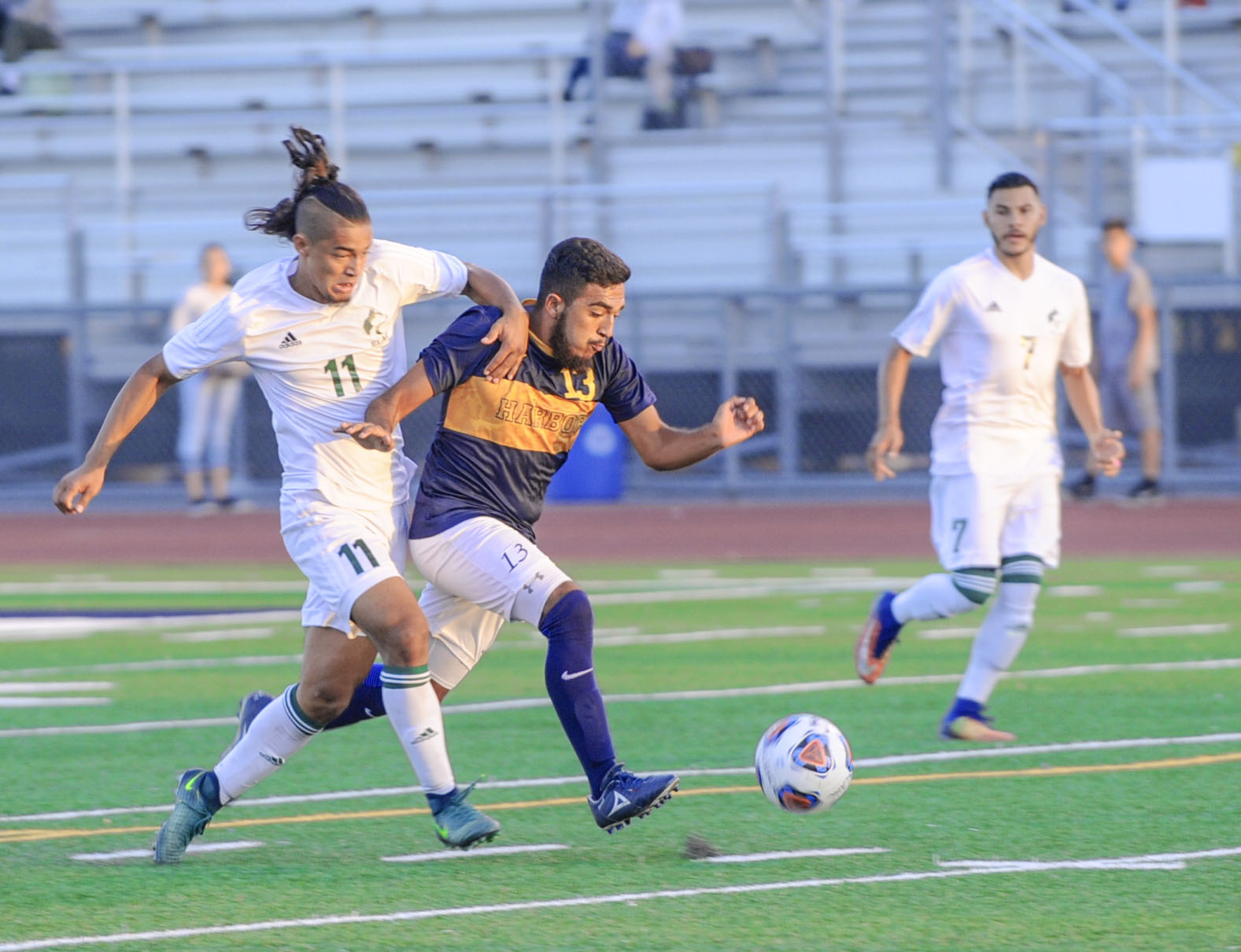 East Los Angeles College freshman forward Kevin Rodriguez is cut off by a LA Harbor's Ivan Avila near the goal in an attempt to score in a 2-1 Huskies win. (Photo by Tadzio Garcia)