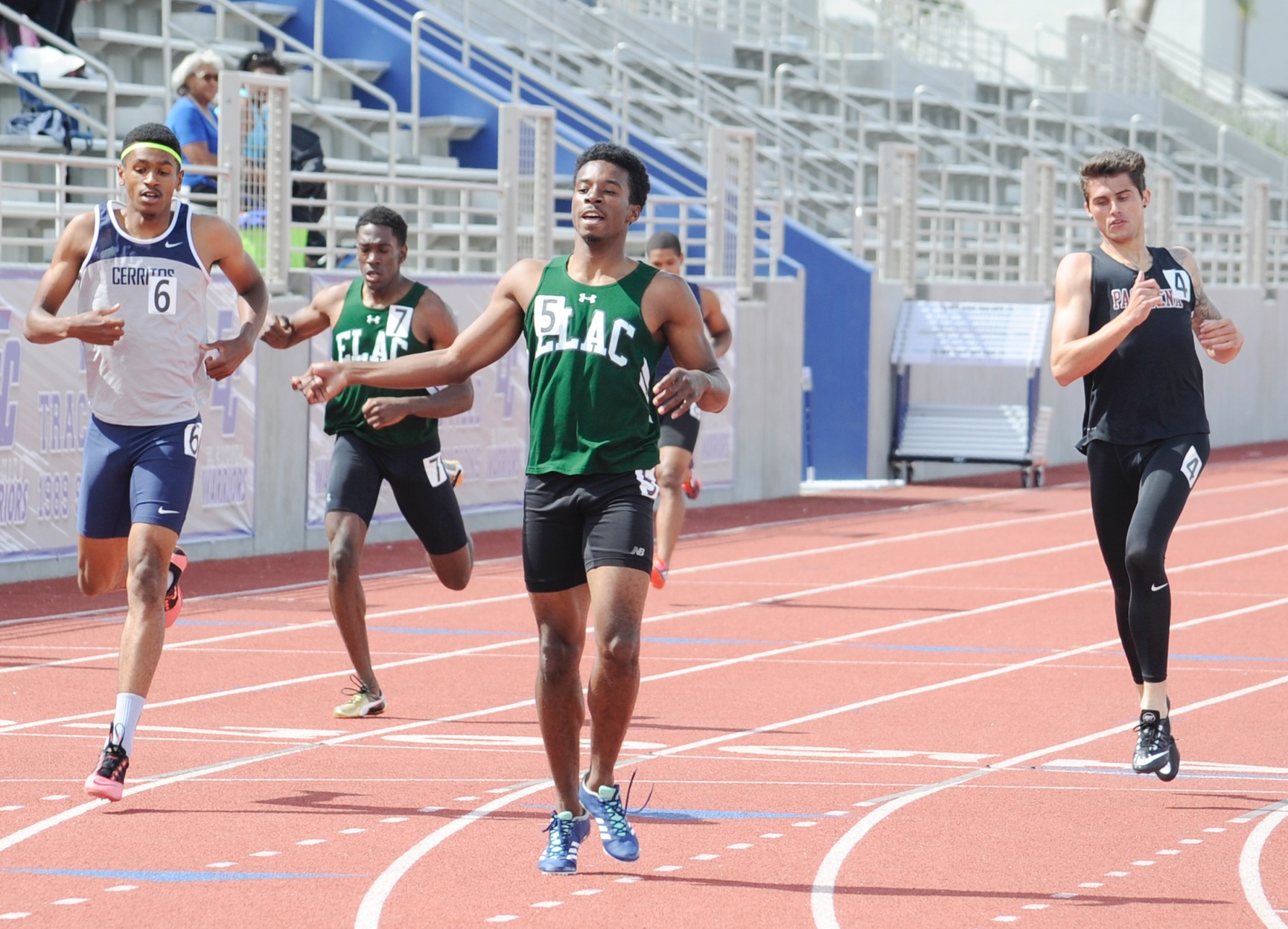 East Los Angeles College sophomore Dale Wilson, No. 5, wins the 400 dash in the SCC Prelims on April 28 while sophomore Akeim Brown places 5th. (Photo by Tadzio Garcia)