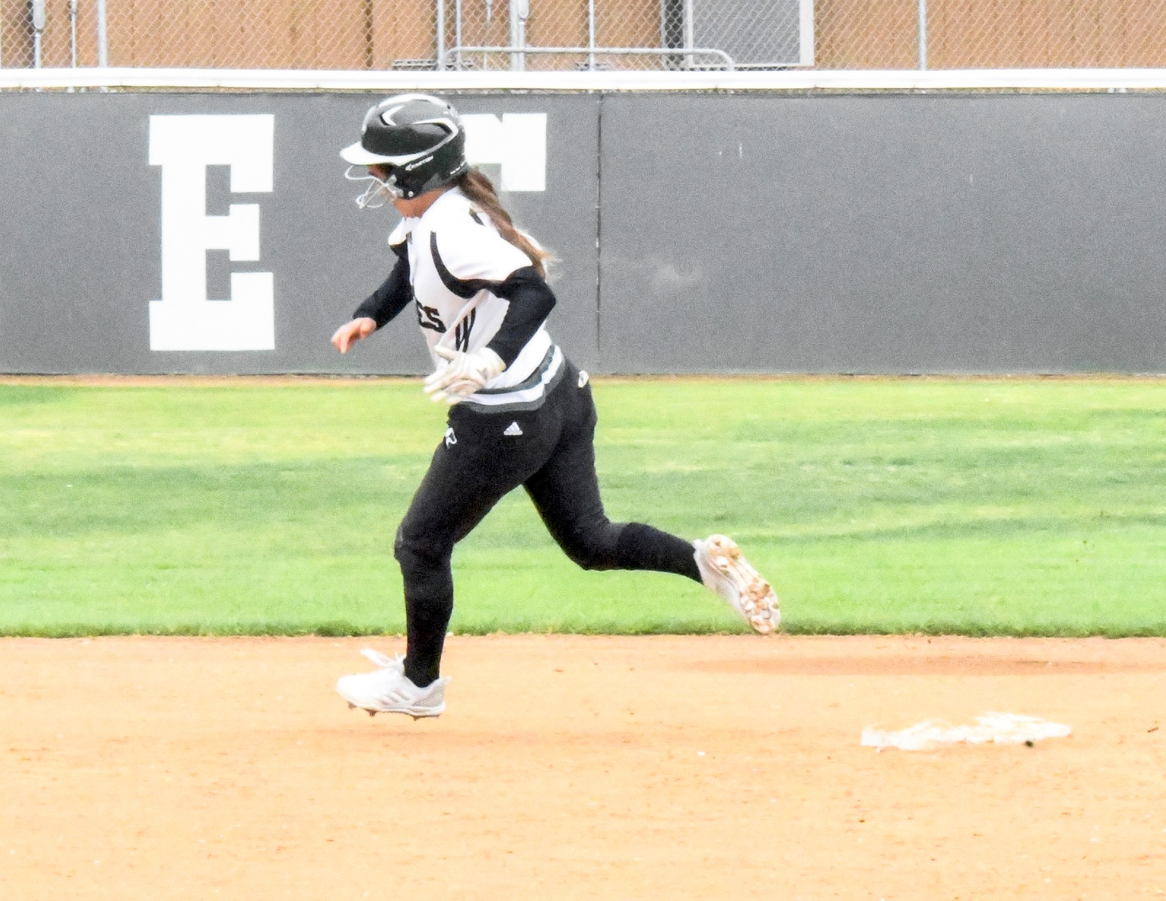 The East Los Angeles College softball team split four games in the Mt. San Jacinto Tournament including a 2-1 win over Santa Barbara City College and an 11-5 win over Grossmont College. Natalie Acosta, pictured, is rounding second base. (Photo by DeeDee Jackson)