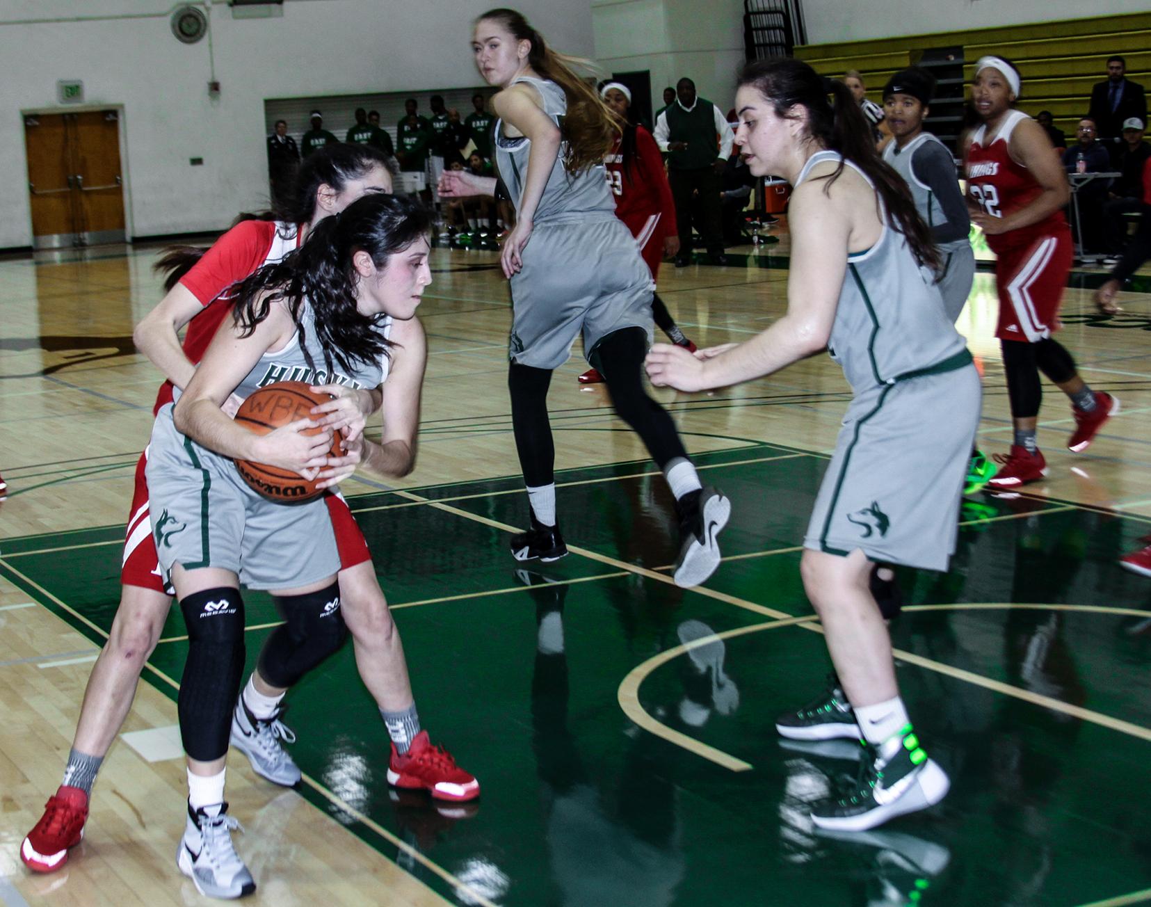 No. 16 East Los Angeles College freshman forward guard Allissa Gomez gets a key rebound in the waning seconds of a 57-54 upset win against No. 5 Long Beach City College. (Photo Courtesy of Erik Sarni)
