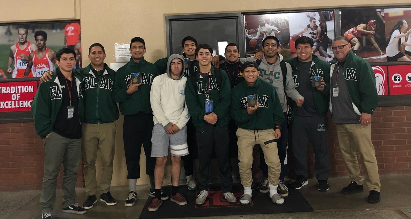 Coach Valle (right) pictured with the ELAC Wrestling team at the 2019 State Championships.