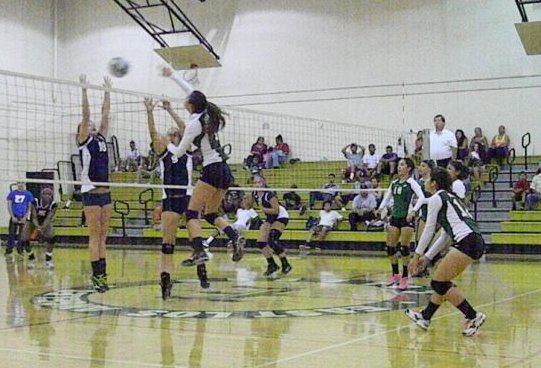 Brianna blasts a power shot past the Warrior's block.