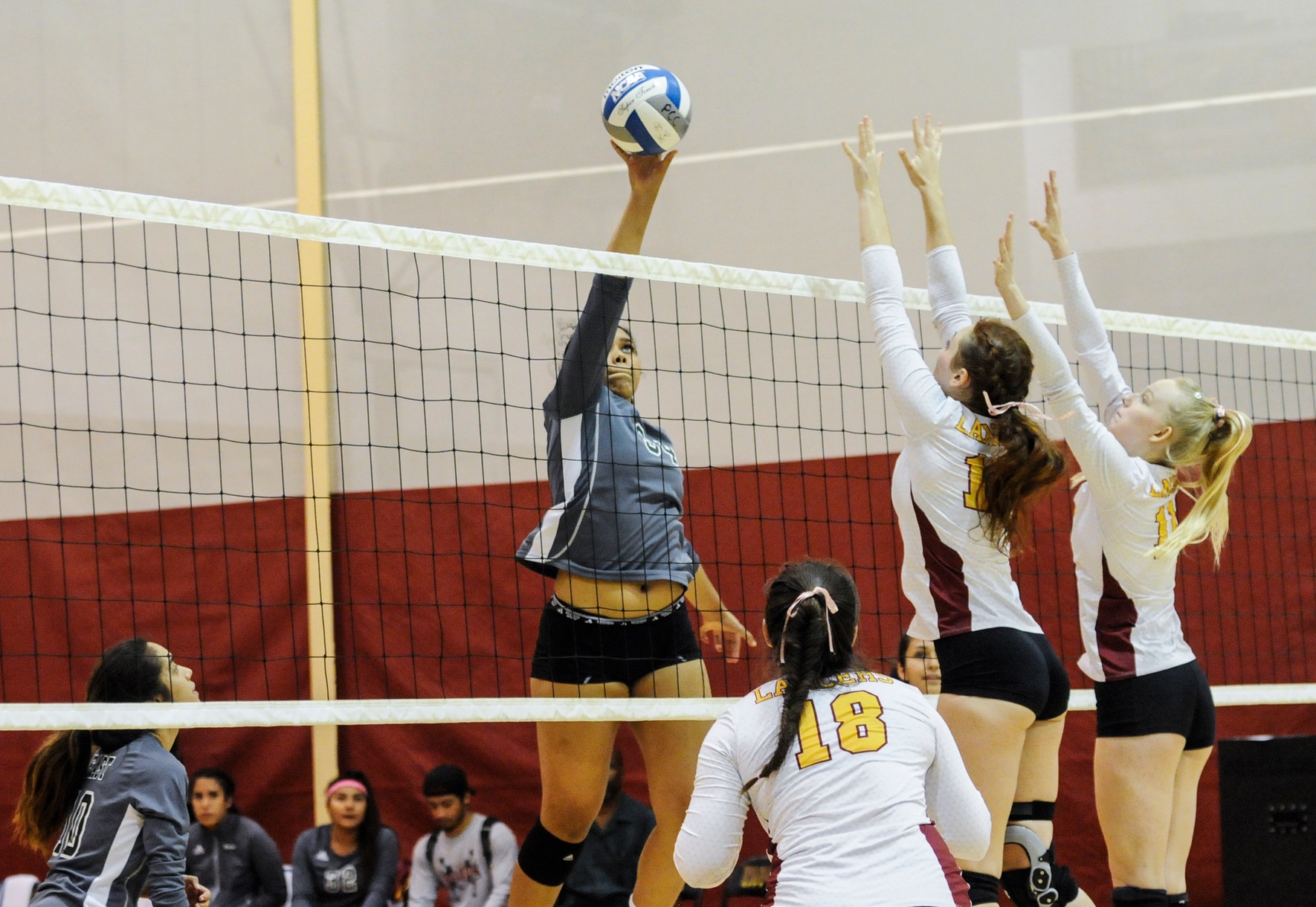 East Los Angeles College sophomore middle hitter Kayla Dickerson attempts a kill in a 3-2 win against Pasadena City College, Oct. 3, 2018. (Photo by Tadzio Garcia)